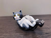 Purrfectly playful, this frisky feline is ready to play and is hardly stationary at all! There's always room for a kitty on your desktop, this one holds tape! Material: Polyresin, Metal, ABS Packaging: Color Box