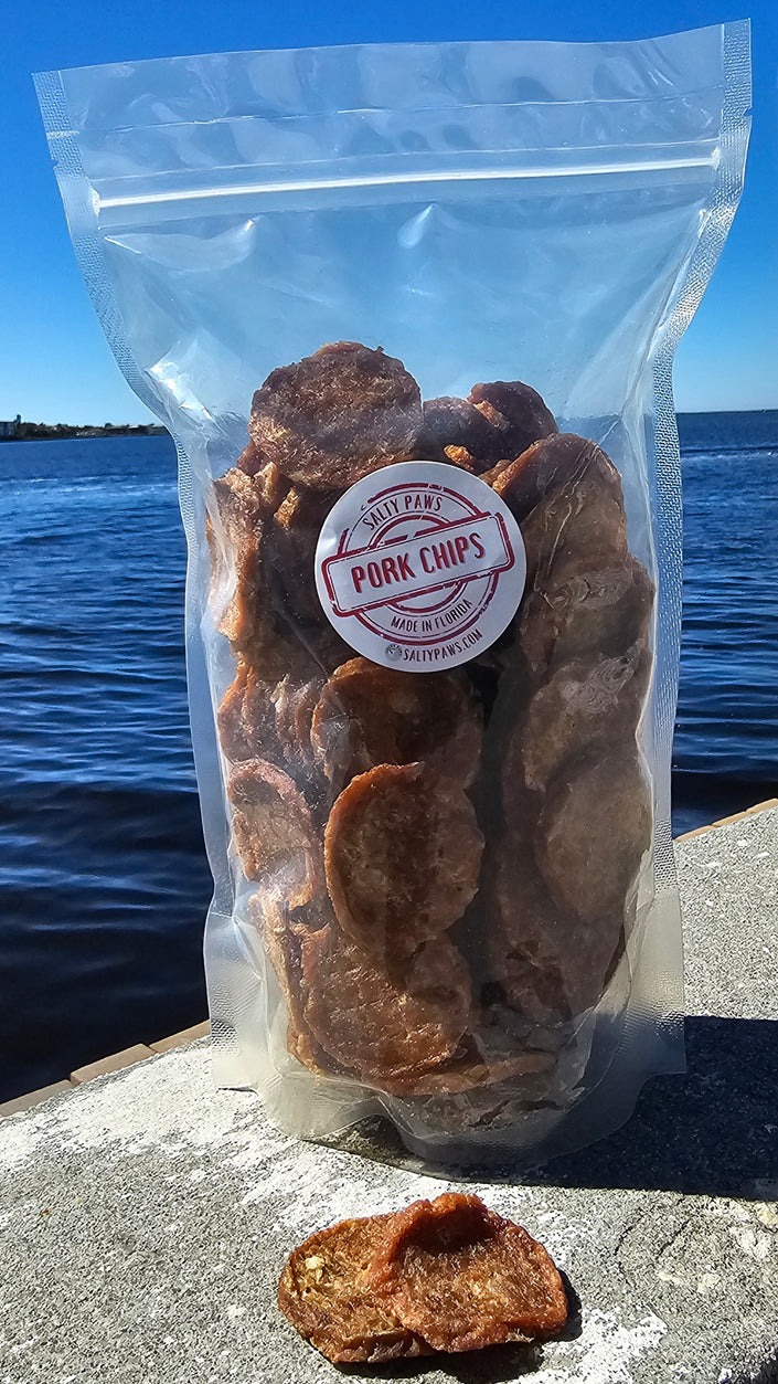 Salty Paws&nbsp;Chips are 100% USDA Pork. We use only the best hormone and GMO-free pork available. We dehydrate them for hours to create a completely healthy, non-fattening treat. Many of our customers say their furry friends just can't get enough of these addictive lil' nuggets! No meat or poultry biproducts All USA sourced & 100% Human grade ingredients No Soy or Corn All Life Stages Hand made in&nbsp;Florida. Comes in Small 5 oz or Large 1lb packages.