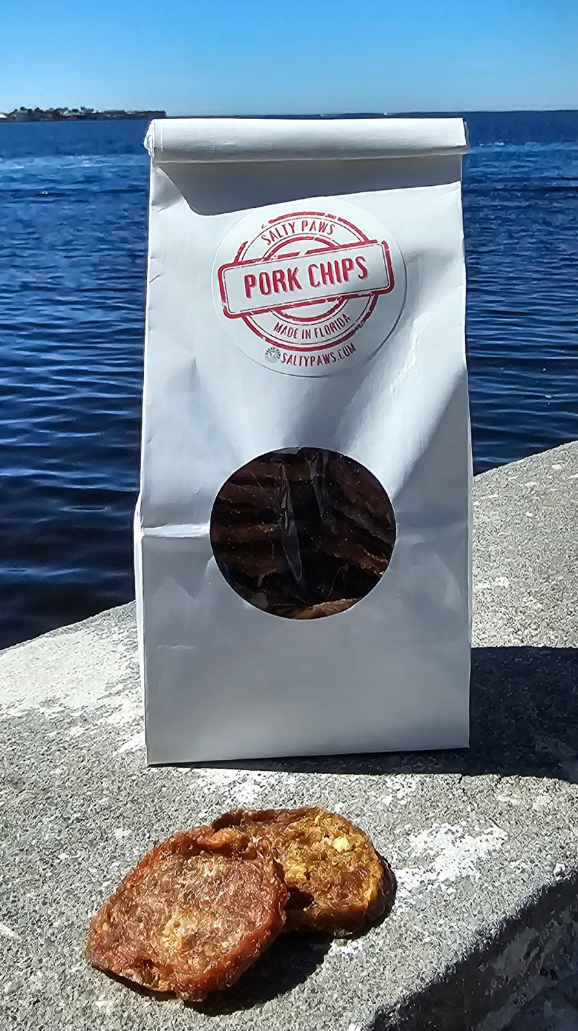 Salty Paws&nbsp;Chips are 100% USDA Pork. We use only the best hormone and GMO-free pork available. We dehydrate them for hours to create a completely healthy, non-fattening treat. Many of our customers say their furry friends just can't get enough of these addictive lil' nuggets! No meat or poultry biproducts All USA sourced & 100% Human grade ingredients No Soy or Corn All Life Stages Hand made in&nbsp;Florida. Comes in Small 5 oz or Large 1lb packages.